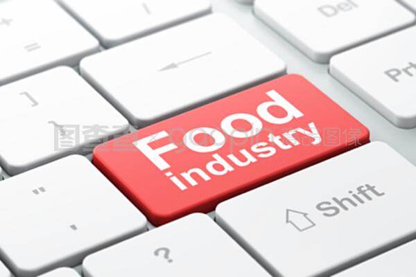 在电脑键盘背景下制造概念食品工业